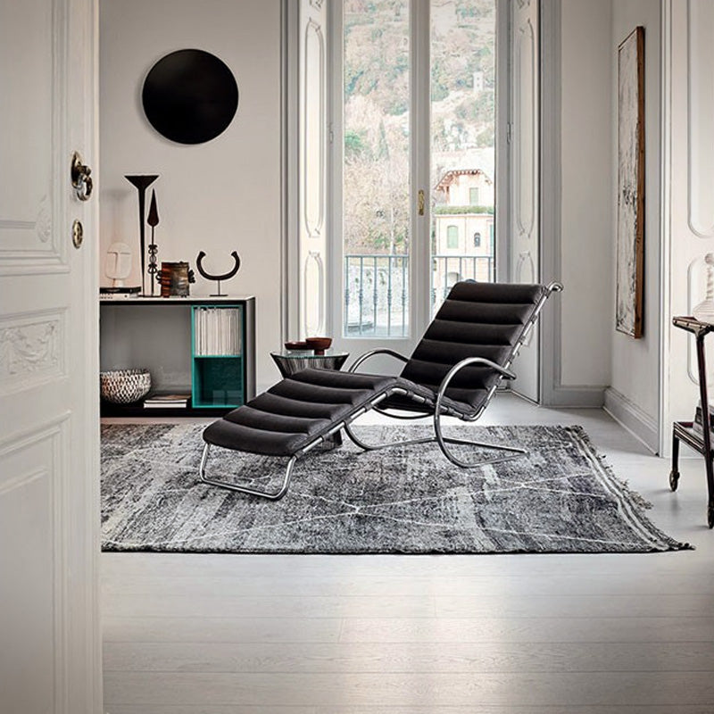 Poltrona Cantilever con apoyabrazos Cuero